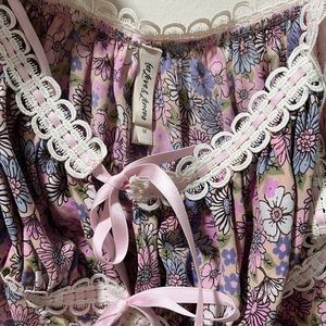 For Love and Lemons Crop Tie Top. Purple mix color with girly frills.